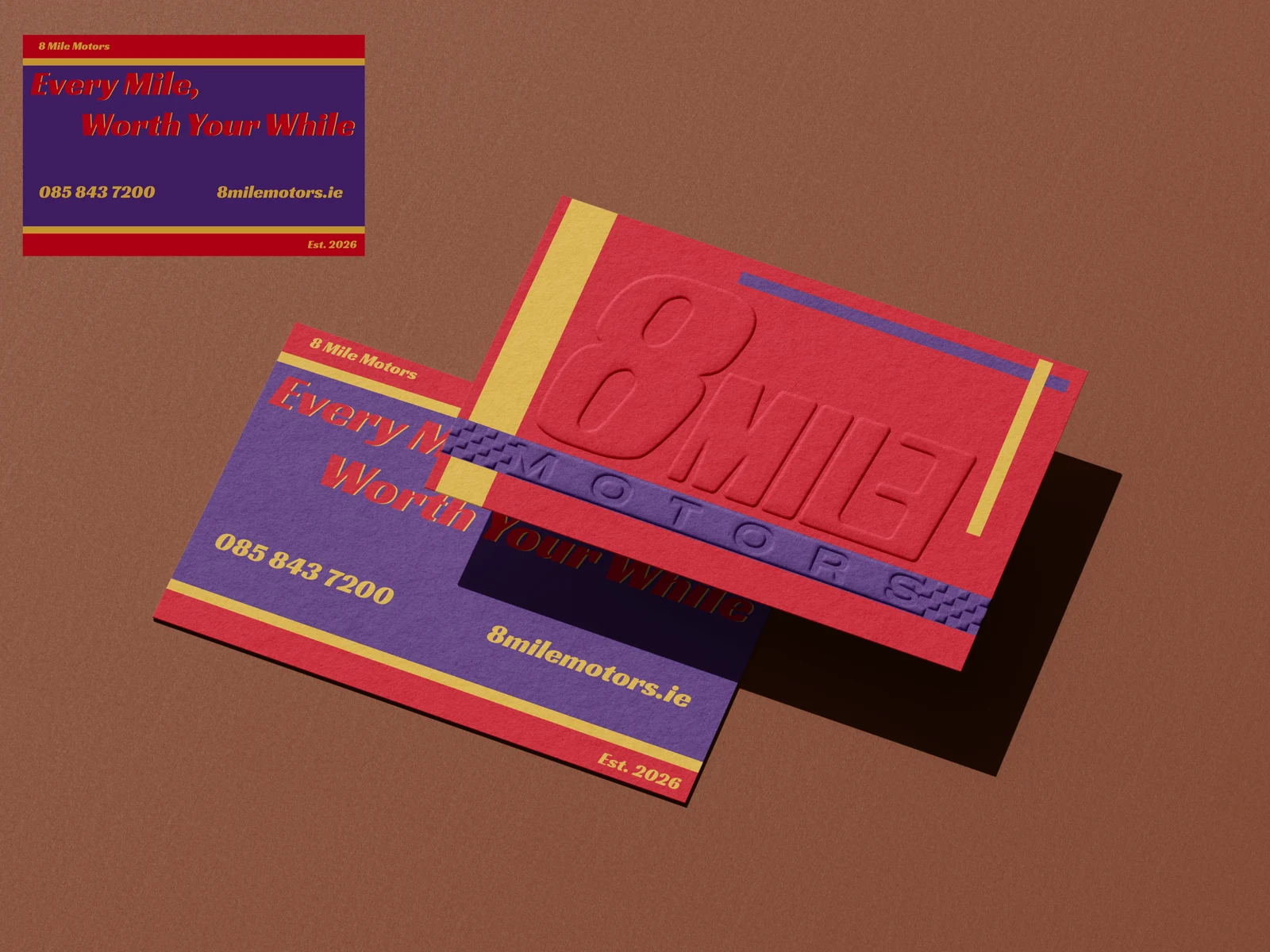 Red, purple and gold 8 Mile Motors business-card mockup with embossed lettering.
